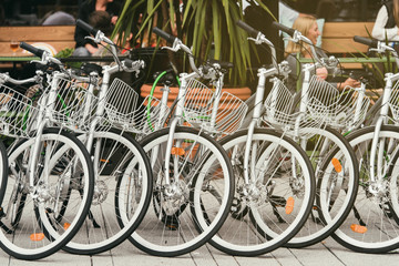 Fototapeta na wymiar Bikes for hire on Stockholms city street, modern clean urban transport. Sweden