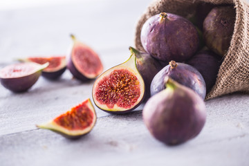 A few figs freely lying on old wooden table