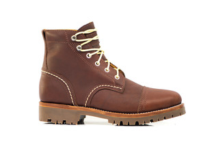 Men’s ankle boot with oil full grain leather isolated on white background, side view , closed up