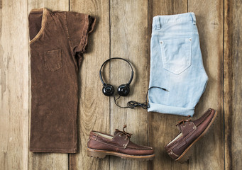 Men's casual outfits with man clothing and boat shoe on wood background, Top view