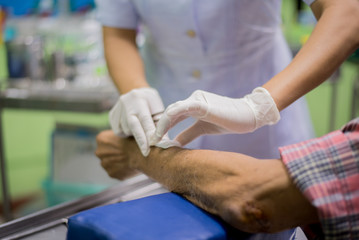 hands of nurse and patient.