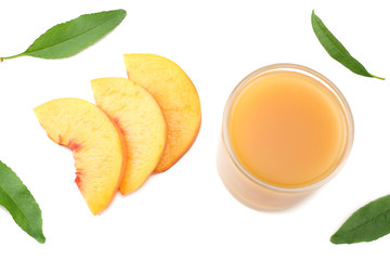 glass of peach juice with peach fruit, green leaf and slices isolated on white background. top view