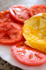Fresh plain omelette with tomatoes