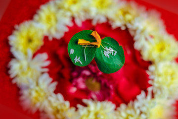 Happy Dussehra greeting card , green leaf and rice