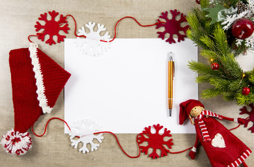 Flat lay view of empty sheet of white paper, for making Christmas gifts wish list or write a letter to Santa Clause, Christmas commercial background.