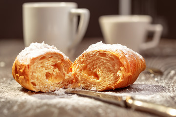 Breakfast with croissant with cream and coffee