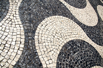 Pavement of black and white. The texture of the pavement. Selective focus