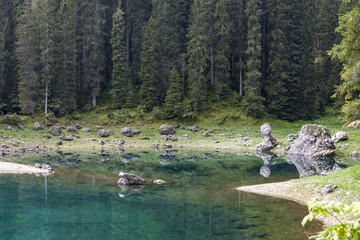 ﻿﻿reflections on Lake Carezza karersee, Nova Levante, South Tyrol.