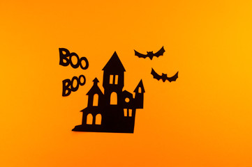 Black padlock from paper orange background.