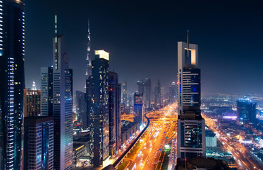 Dubai downtown night view with modern skyscrapers