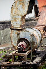 Old rusty vents on the roof of an abandoned building. Rust