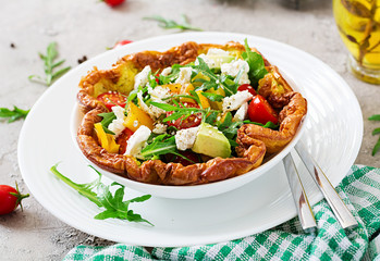 Omelet with fresh tomatoes, avocado and mozzarella cheese. Omelette salad. Breakfast. Healthy food.