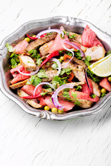 Salad with meat and watermelon