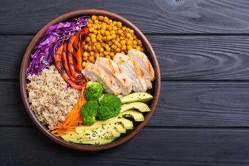 Buddha bowl with avocado , chicken , pepper , quinoa and chickpea