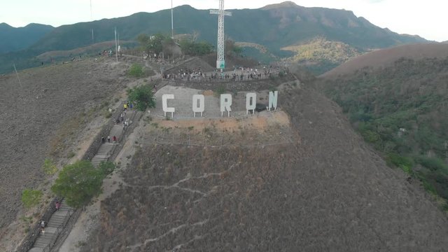 Aerial drone shot away from people at the city sign, on the top of Mount Tapyas, at Coron island, in Philippines, Asia