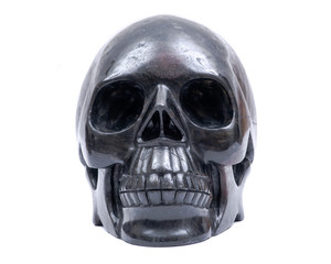 Obraz premium Black realistic carved stone skull with Astrophyllite blades from Russia, isolated on white background.
