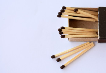 Matches scattered on a white background.