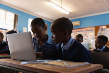 Students using laptop in the classroom
