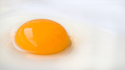 Fresh ragged egg on white plate ready to cook breakfast.