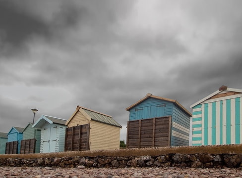 Boarded up beach huts at Budleigh Salterton, East Devon, UK out of season, winter.