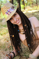 Joyful pretty woman with dreadlocks