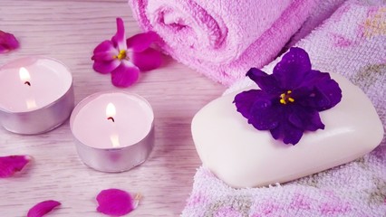 Romantic composition with candles and flowers.The concept of Spa,cosmetic,procedure,treatment.
