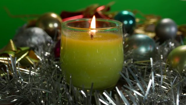 christmas bucket candle and decoration over green screen