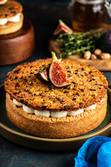 Tarte on sand base with fresh figs, almonds and crispy waffle with almonds and cocoa powder. Fresh Homemade Fruit Tart with berries