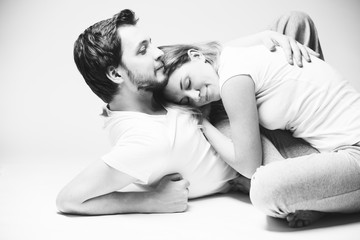 Beautiful woman and man gently hug each other. The head of a woman on the chest of a man.
