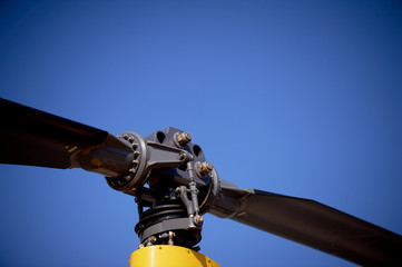 The rotor of the helicopter against the blue sky. Details in macro. Helicopter flights