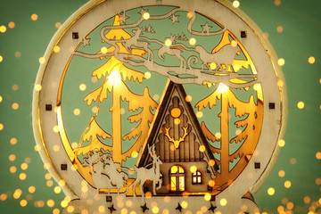 Image of magical christmas scene of wooden pine forest, hut and santa claus over sleigh with deers.