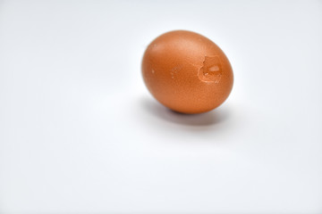 Cracked broken egg shell isolated over white background.