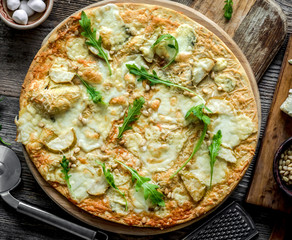 Pizza four cheeses on the table