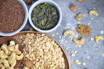 Various nuts on stone table. Top view with copy space