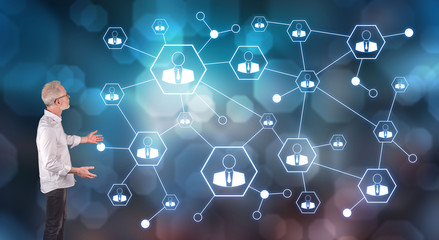 A social network explained by a businessman on a wall screen