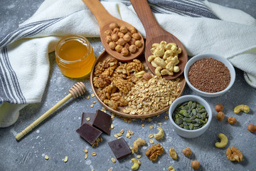 Various nuts on stone table. Top view with copy space