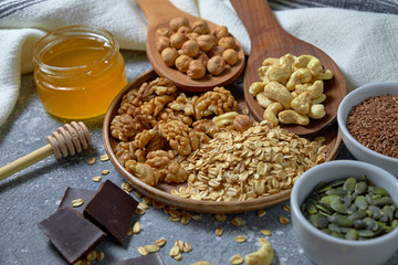 Various nuts on stone table. Top view with copy space