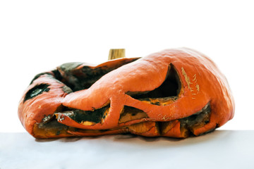 rotten pumpkin after Halloween isolated on white background 