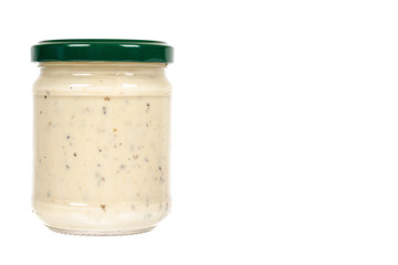Creamy sauce with truffle for pasta in glass jar isolated on white background, copy space template