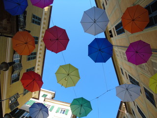  Beautiful photography of the street decoration with some coloured umbrellas over the city of Genova 