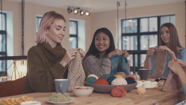 Young girls knitting at the master class
