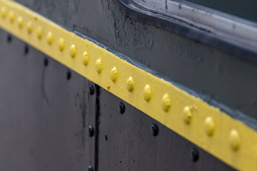 rivets on metal train wall