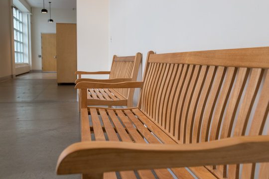 Sad Empty Benches Wait In An Empty Corridor, Closeup, No People