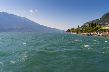 Landscape of Garda lake and the beach of Limone sul Garda, Lombardy region of Italy