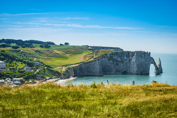 Spectacular natural cliffs Aval of Etretat and beautiful famous coastline, Normandy, France, Europe.