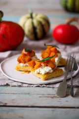 polenta crostini with butternut squash ricotta sage.selective focus
