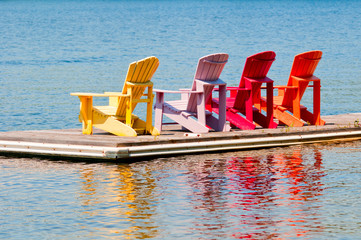 Colorful chairs on a dock
