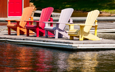 Colorful chairs on a dock