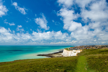 Fototapeta na wymiar Peacehaven, Sussex UK from Newhaven heights at low tide on a sunny summer day