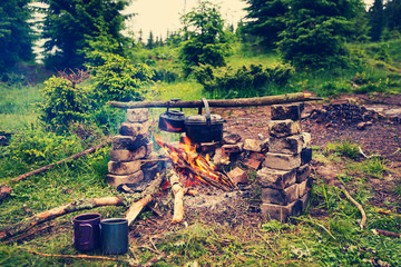 Boiler and small kettle is heated on a bonfire